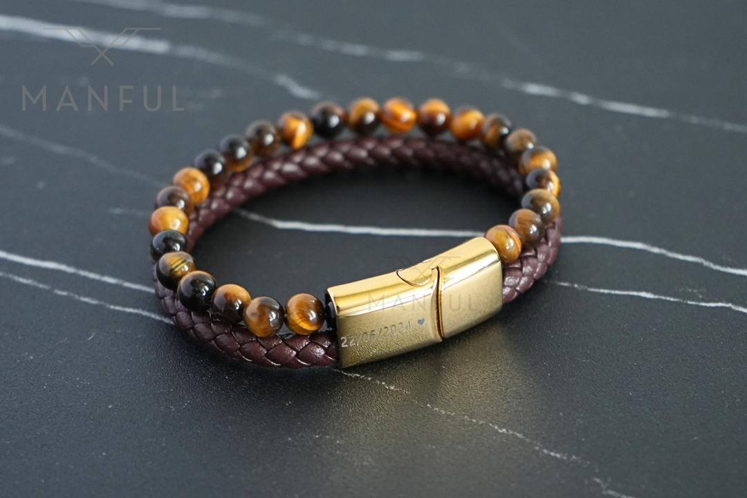 Tigers Eye Bead And Leather Bracelet Gold, overhead flat lay on dark marble showing the full loop