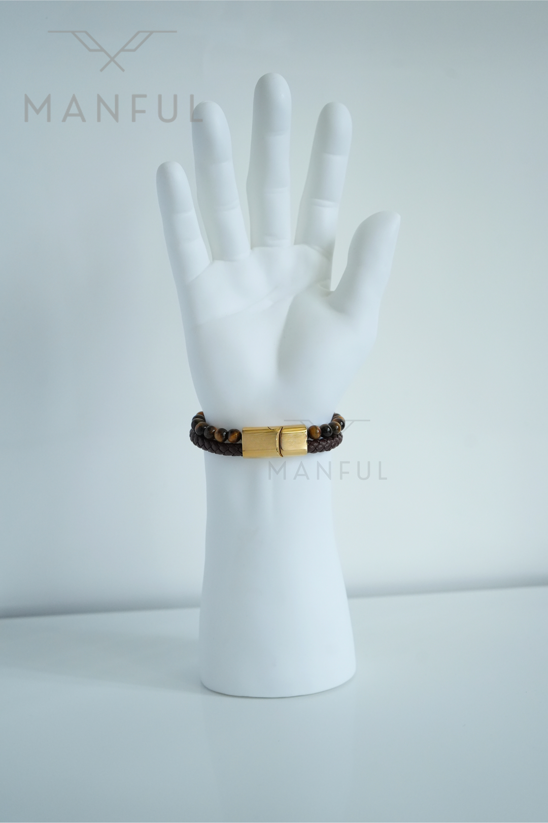 Tigers Eye Bead And Leather Bracelet Gold, worn on a man's wrist with the clasp facing forward