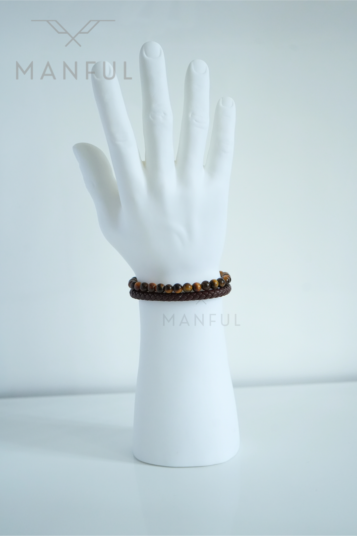 Tigers Eye Bead And Leather Bracelet Gold, worn on a man's wrist with the clasp turned to the side