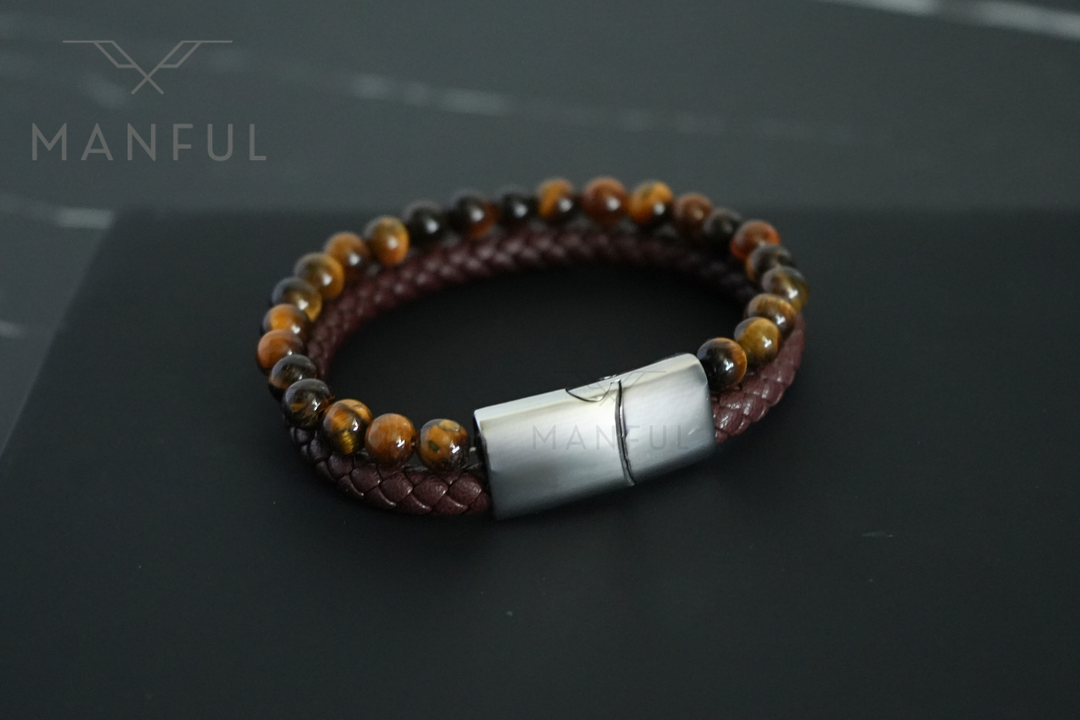 Tigers Eye Bead And Leather Bracelet Silver, angled on dark slate with the clasp turned toward the camera