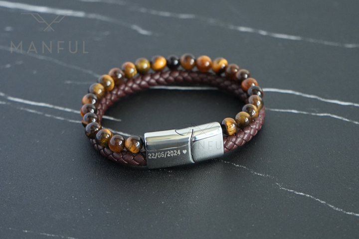 Tigers Eye Bead And Leather Bracelet Silver, close-up on dark slate showing a date engraved on the clasp