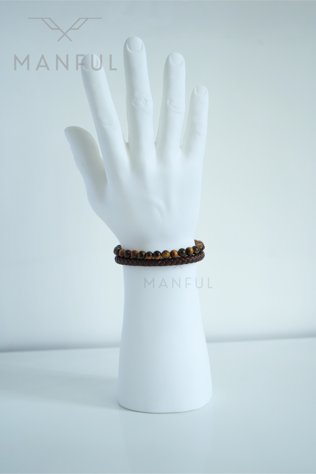 Tigers Eye Bead And Leather Bracelet Silver, worn on a man's wrist shown from a side angle