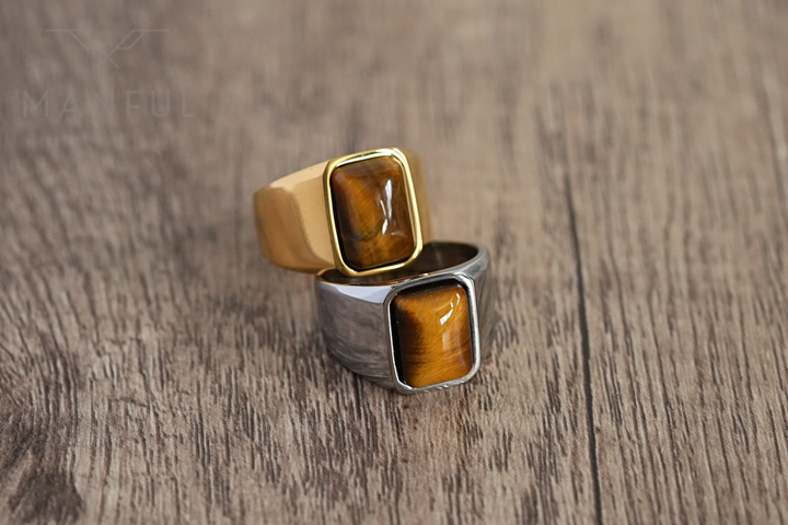 Tigers Eye Signet Ring Silver, paired beside its gold version on a wood surface