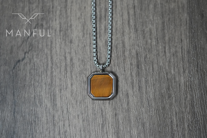 Tigers Eye Square Necklace Silver, laid flat on wood with the chain draped above