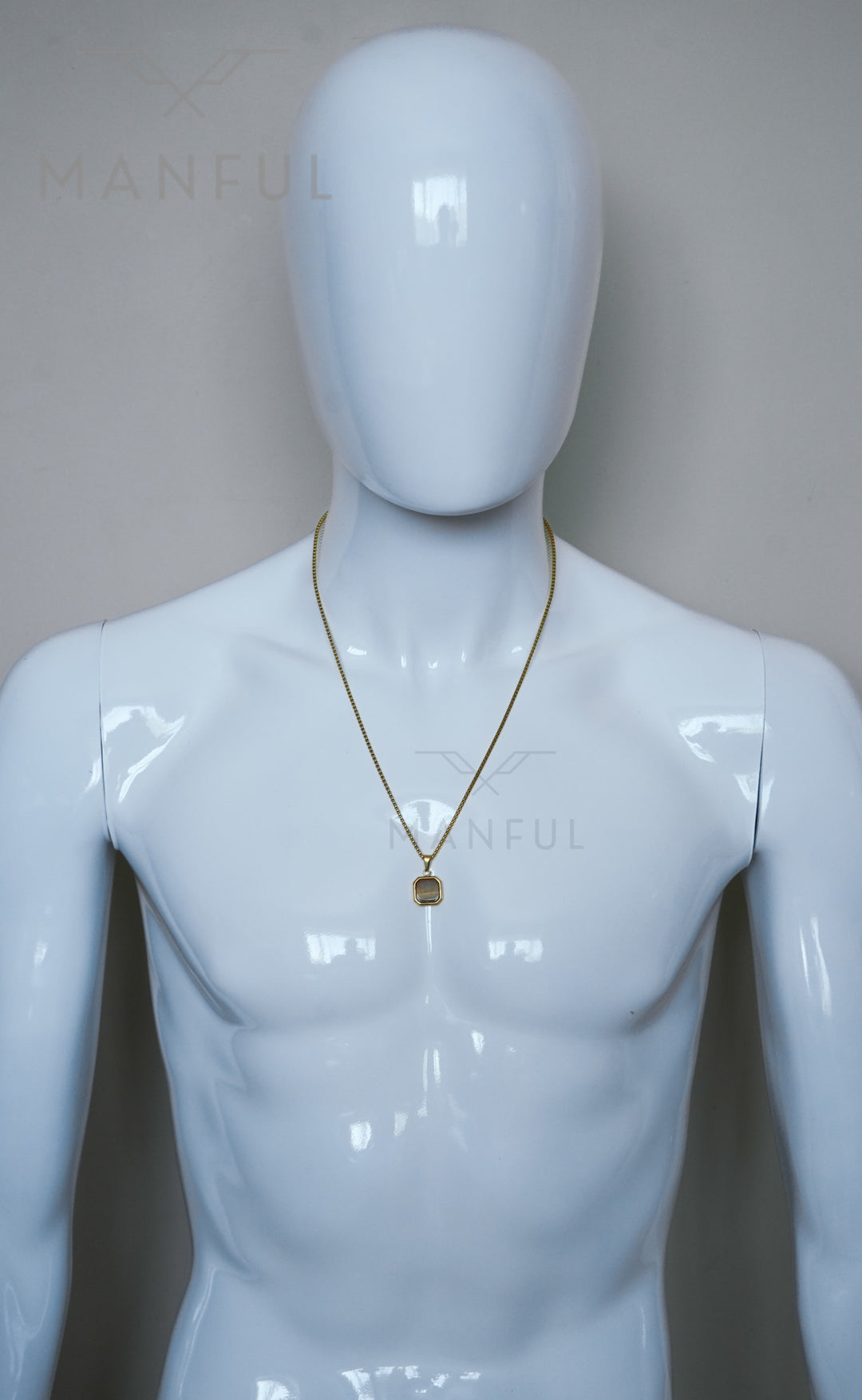 Tigers Eye Square Necklace Gold, worn on a mannequin's neck against a plain grey background