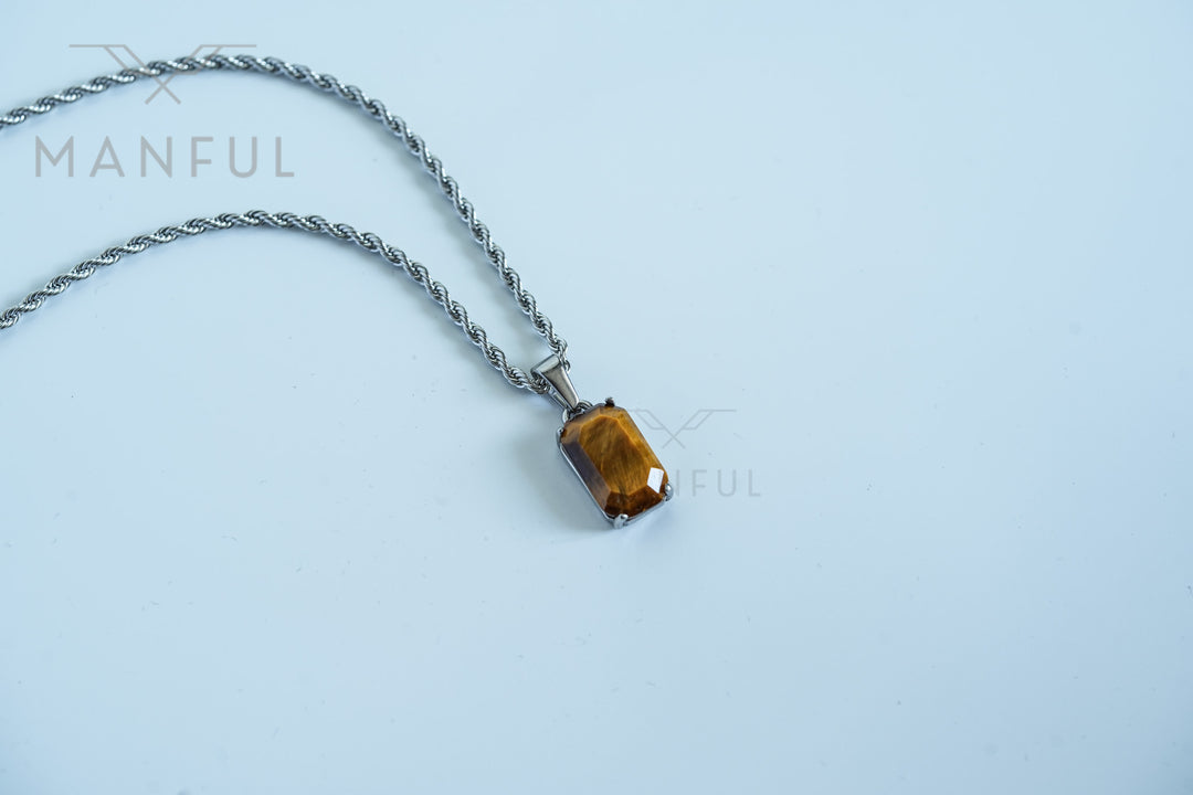 Tigers Eye Stone Pendant Silver, resting on a plain white background with the chain draped loosely