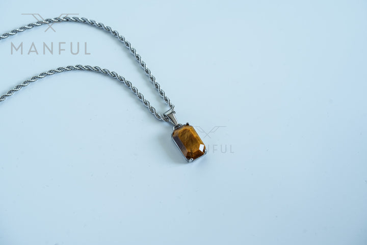 Tigers Eye Stone Pendant Silver, resting on a plain white background with the chain draped loosely