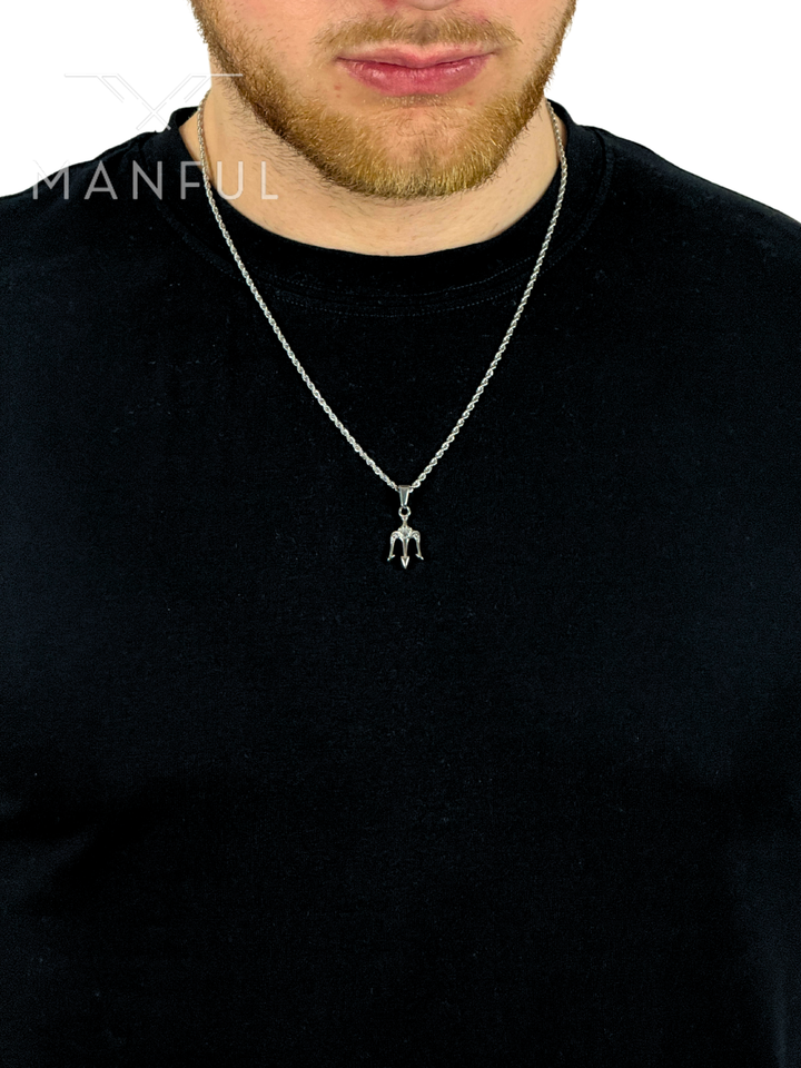 Trident Pendant Necklace Silver, worn around a man's neck over a black t-shirt
