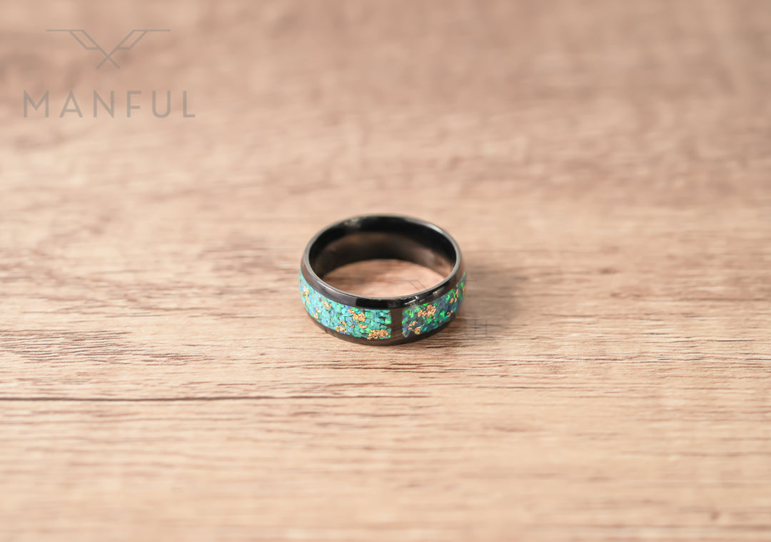 Trinity Opal Ring, standing at an angle on a light wood surface