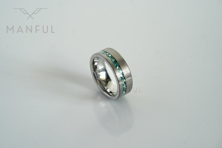 Tungsten Aquamarine Inlay Band Silver, standing off-center on a plain white background