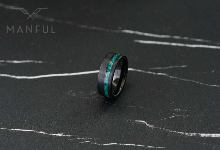 Tungsten Malachite Inlay Band Black, standing upright on dark marble facing the camera