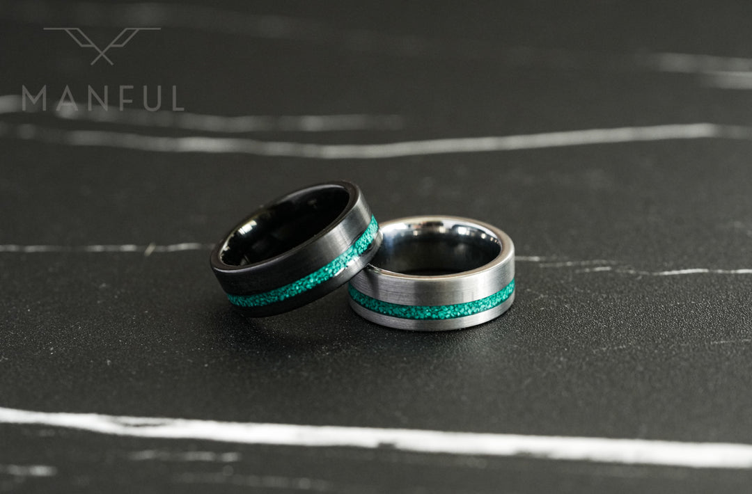 Tungsten Malachite Inlay Band Black, shown beside its silver version on dark marble