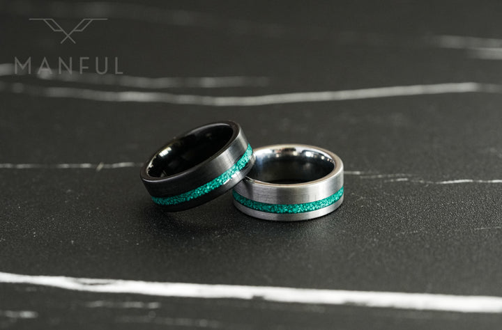 Tungsten Malachite Inlay Band Black, shown beside its silver version on dark marble