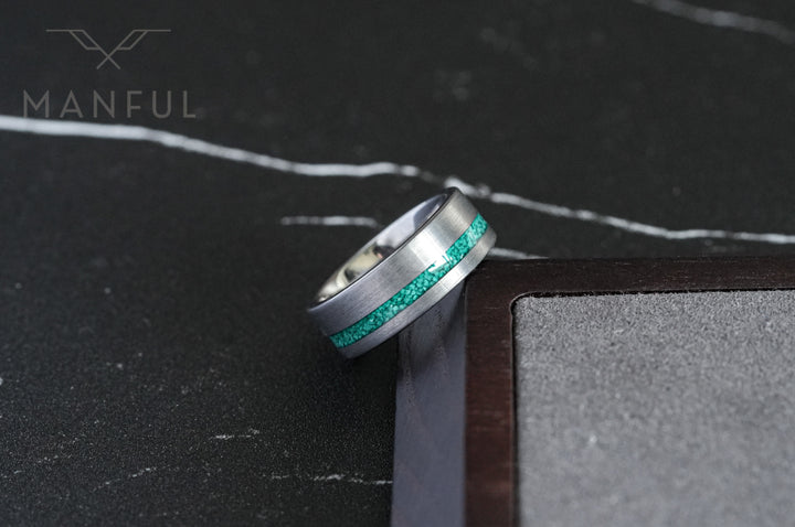 Tungsten Malachite Inlay Band Silver, close-up on a wooden block corner showing the brushed finish