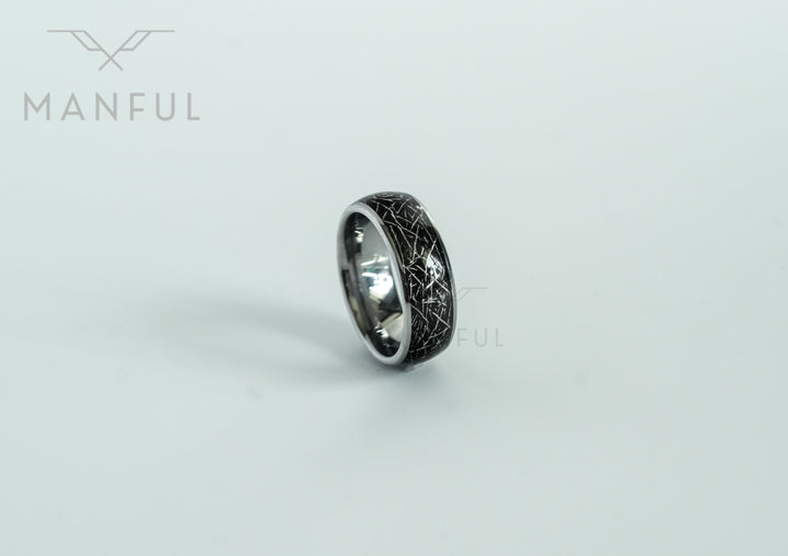 Meteorite Fragment Ring, standing at an angle on a plain grey background with its reflection below
