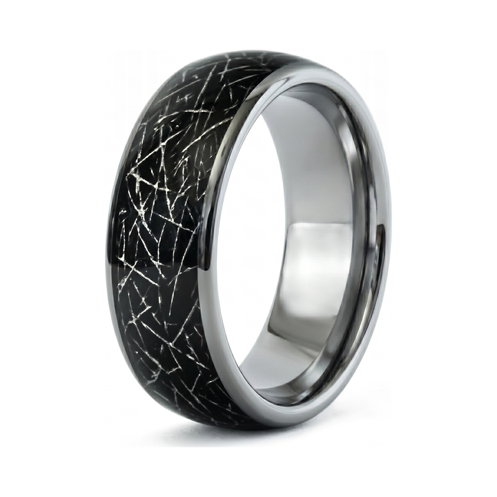 Meteorite Fragment Ring, isolated on white showing the cracked black and silver textured band
