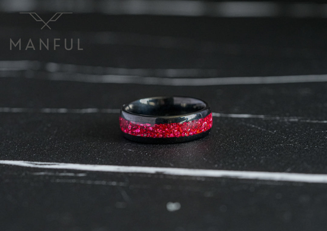 Tungsten Red Opal Black Band, standing upright on a dark textured surface with a soft blurred backdrop
