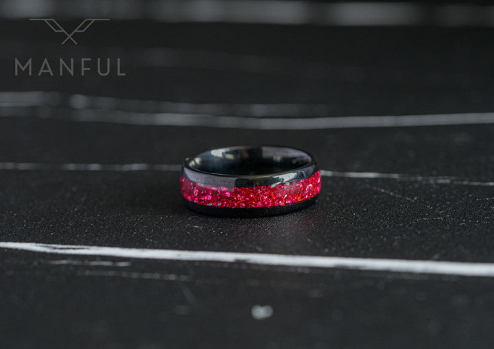 Tungsten Red Opal Black Band, standing upright on a dark textured surface with a soft blurred backdrop