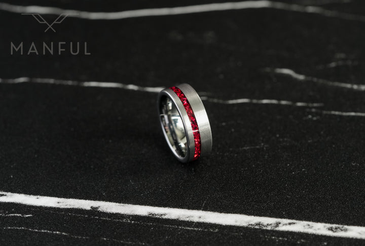 Tungsten Red Opal Inlay Band Silver, standing on dark marble at an angle showing the red inlay
