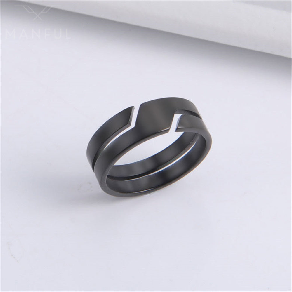 Line Cut Ring Black, standing against a folded white paper backdrop