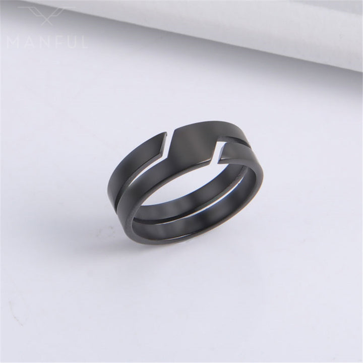 Line Cut Ring Black, standing against a folded white paper backdrop