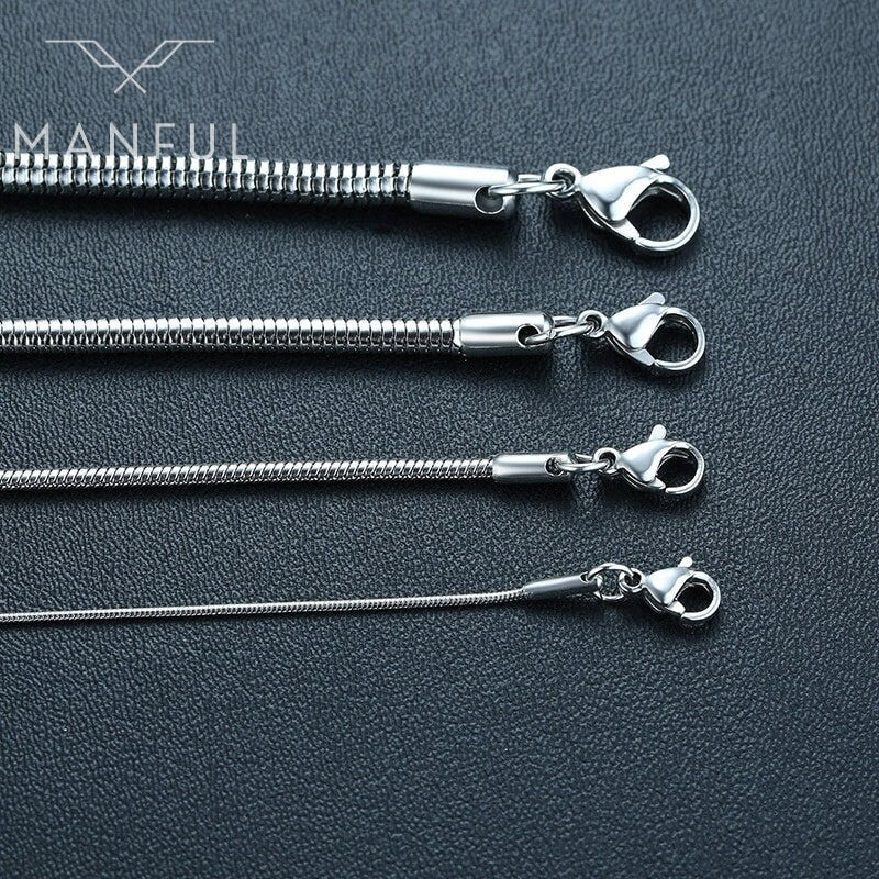 Snake Chain 4mm Silver, laid flat beside three thinner chains to compare widths