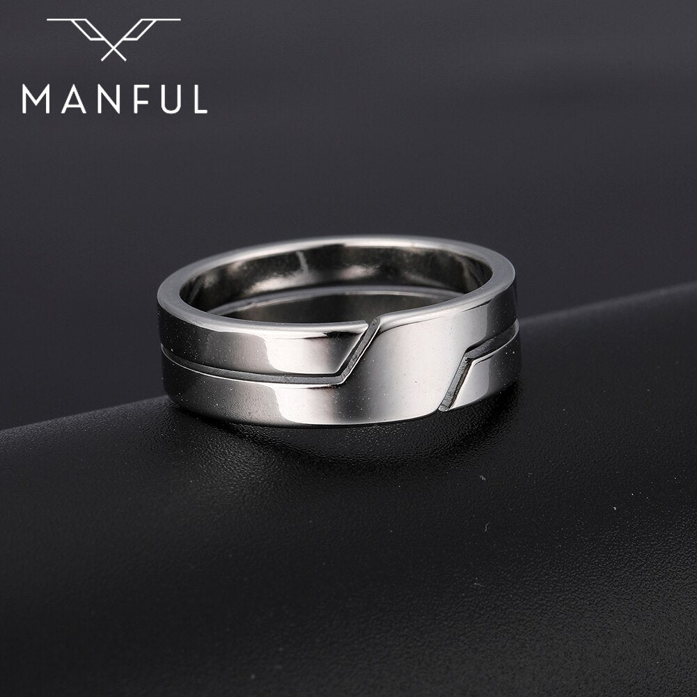 Line Cut Ring Silver, standing angled on a dark surface with a diagonal edge behind
